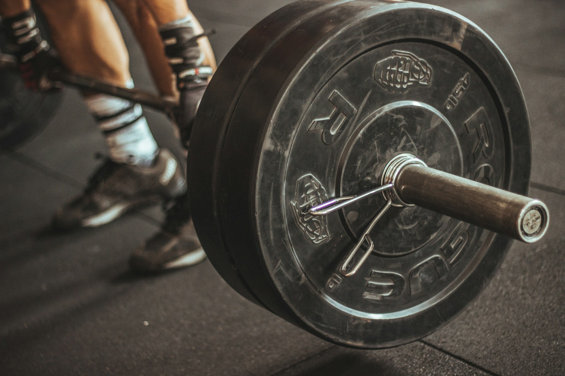 Barbell prepared for a coached strength session